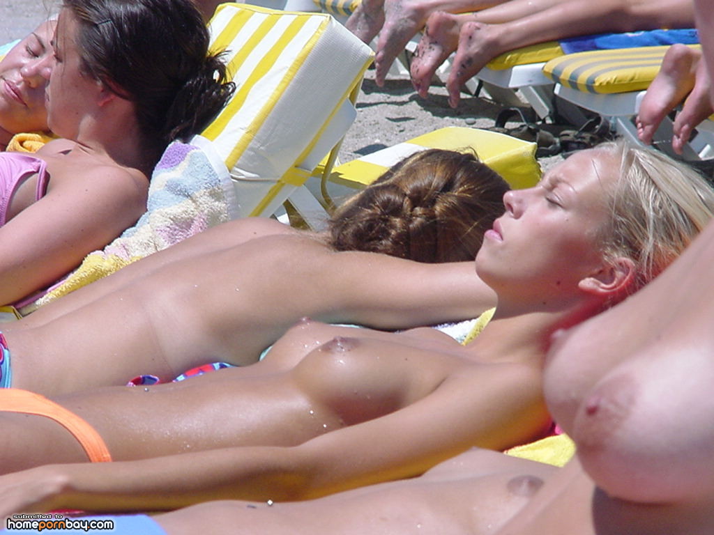 Dazzling blonde topless beach voyeur